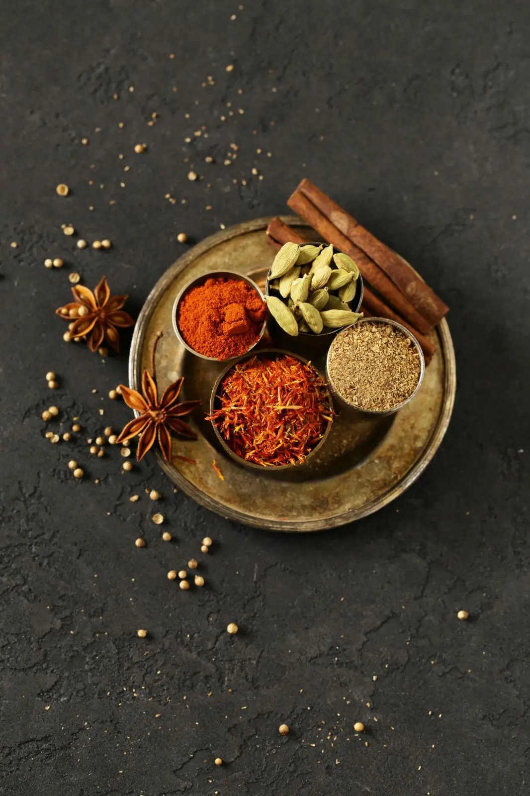 Curry spices in brass bowls